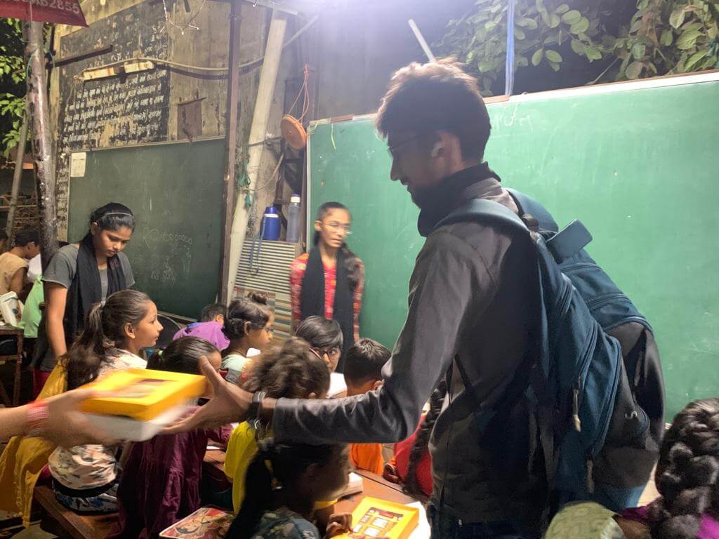 diwali chocolate pack distribution to roadside school kids